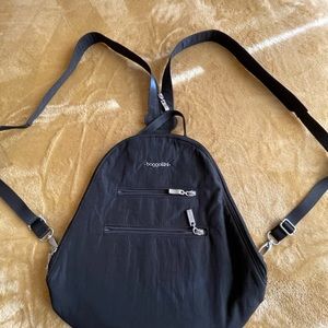 Baggallini convertible sling bag/back pack.Black polyester with silver hardware.
